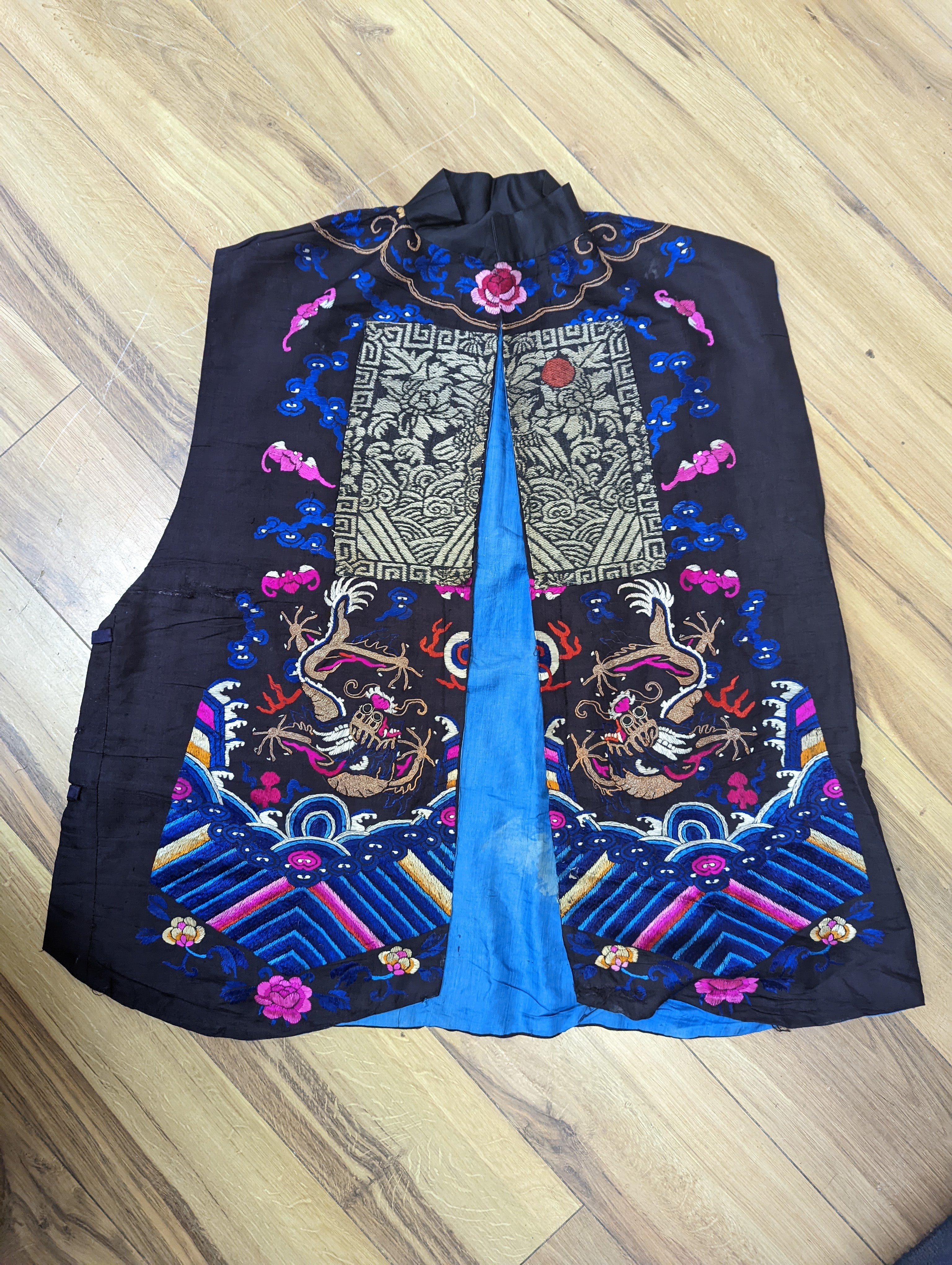 A 1920's Chinese dragon embroidered waistcoat, a cream silk drawn thread dress and a silk crepe black and patterned reversible kimono (3 items).